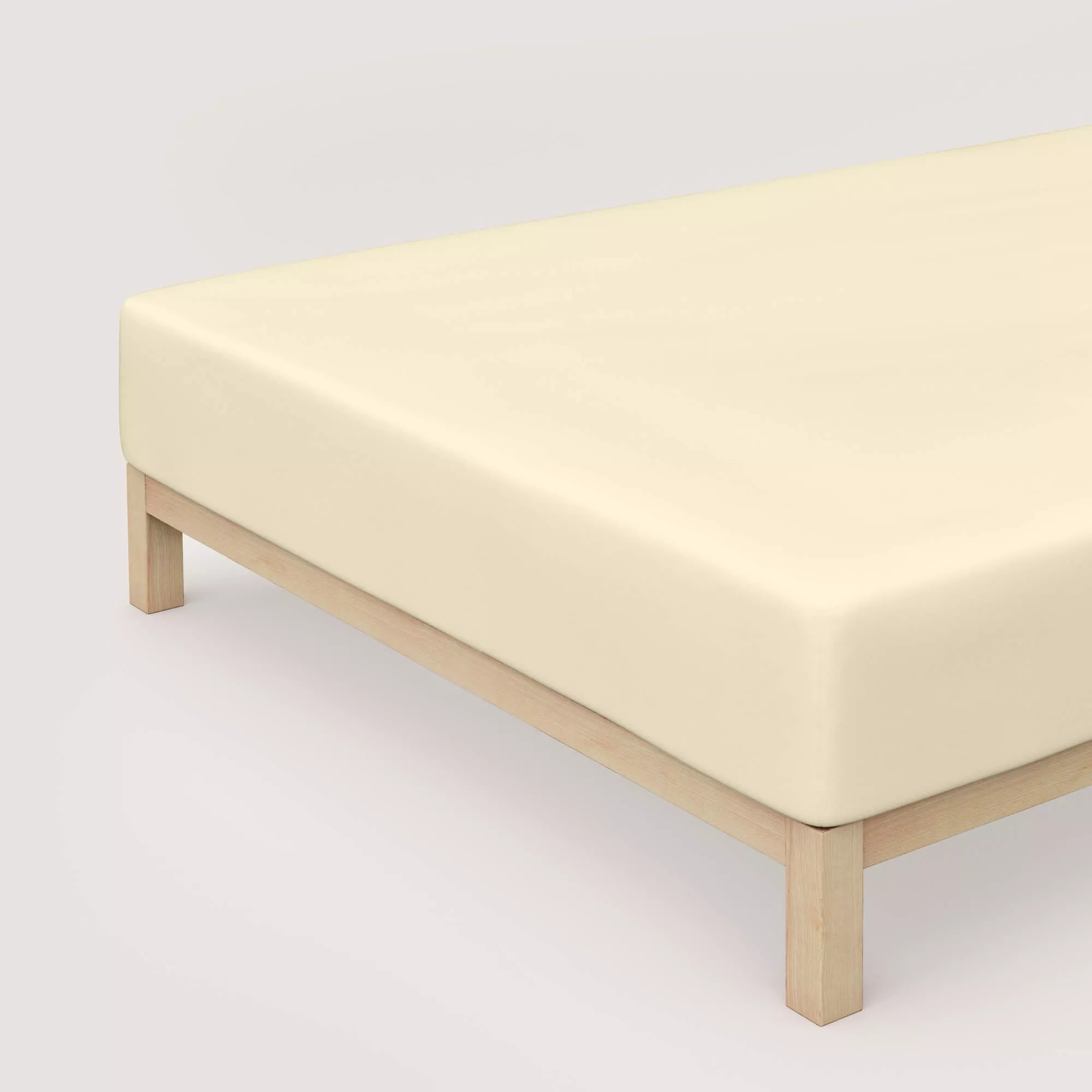Spannbettlaken Pure Boxspring von Schlafgut in Farbe yellow light aus 95% Bio-Baumwolle und 5% Elasthan auf Bett in Vogelperspektive