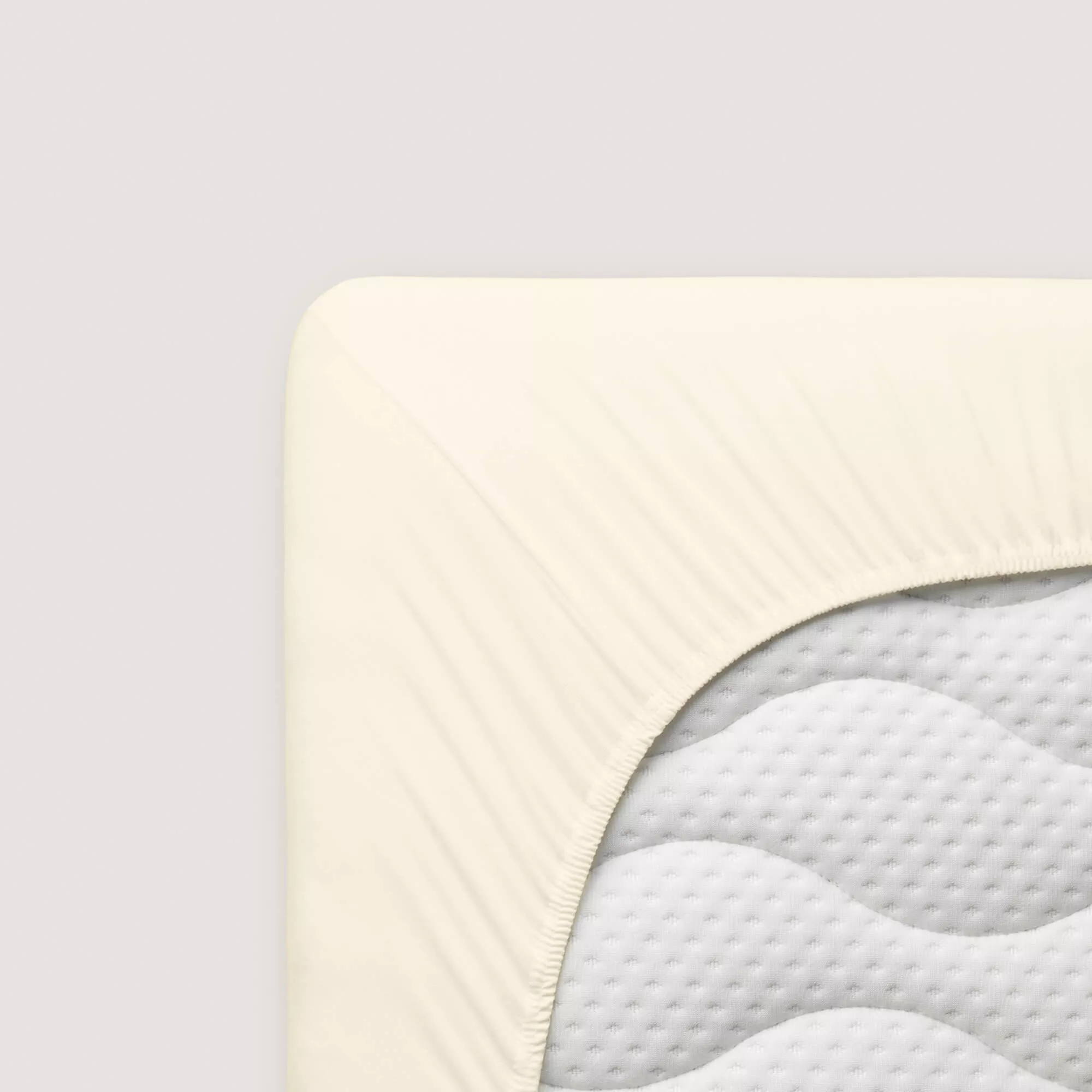 Spannbettlaken Casual von Schlafgut in Farbe yellow light aus 100% Bio-Baumwolle auf Matratze